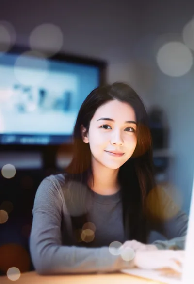 Young Asian Woman Working On Laptop At Night
