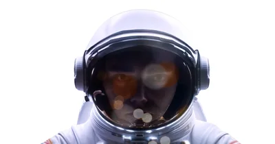 Astronaut Wearing A White Space Helmet Looking Forward