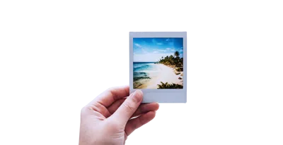 Hand Holding A Polaroid Photo Of A Tropical Beach
