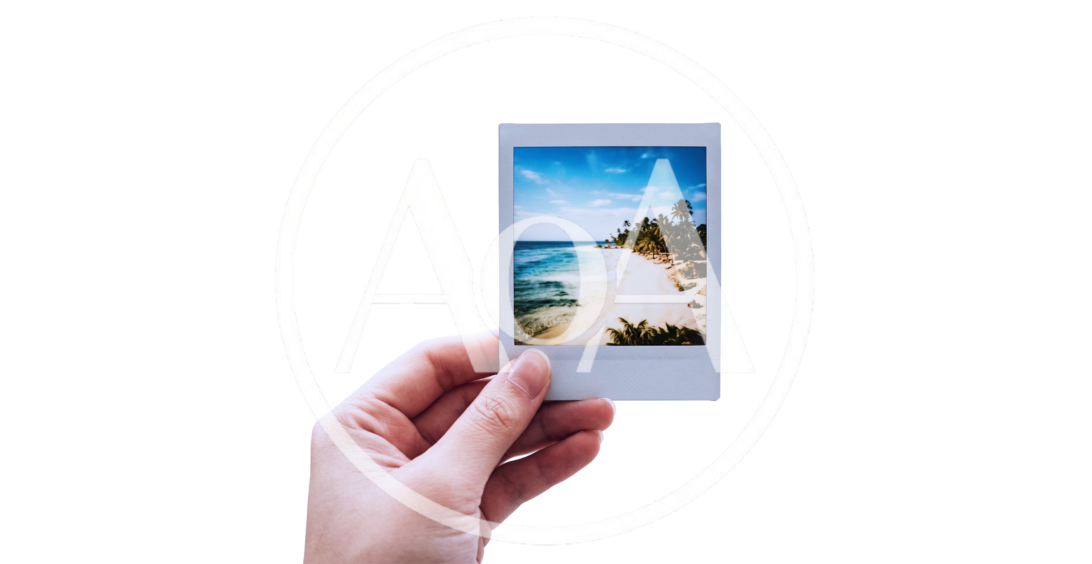 Hand Holding A Polaroid Photo Of A Tropical Beach