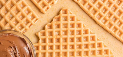 Fresh Waffles With Chocolate Spread On A Table