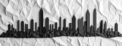 Black Paper Cutout City Skyline On Crumpled White Background
