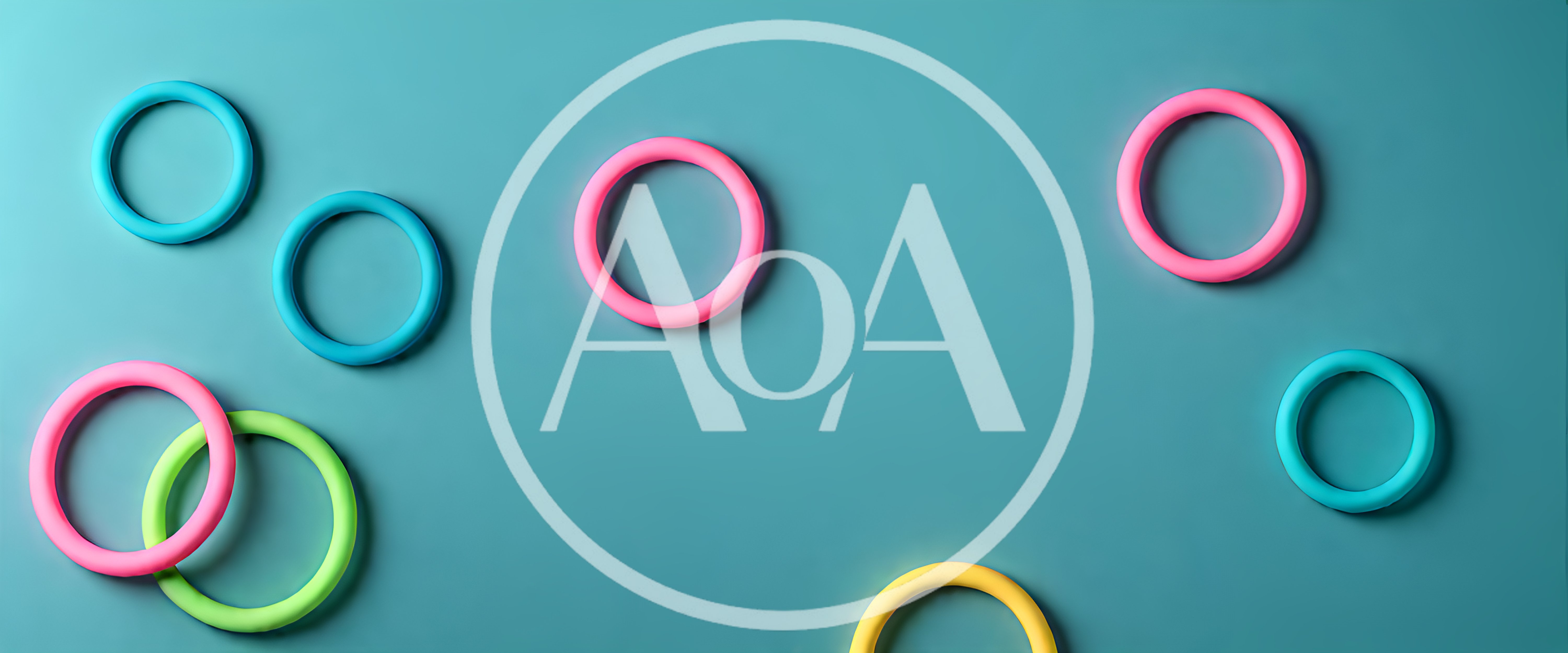 Colorful Plastic Rings Arranged On A Teal Background