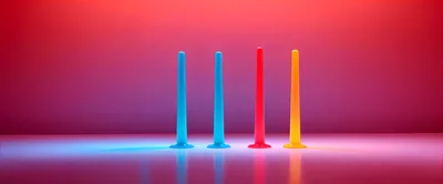 Four Colorful Vertical Pillars On A Reflective Surface