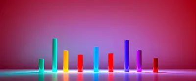 Colorful 3D Bar Chart Cylinders On Reflective Surface