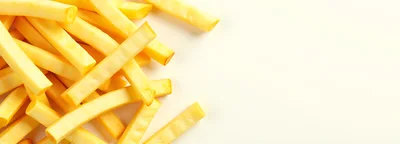 Fresh Cut Raw Potato Fries on White Background