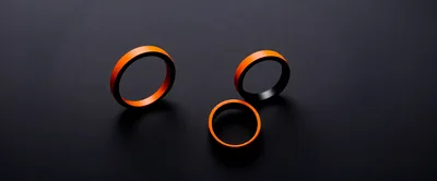 Three Orange And Black Minimalist Rings