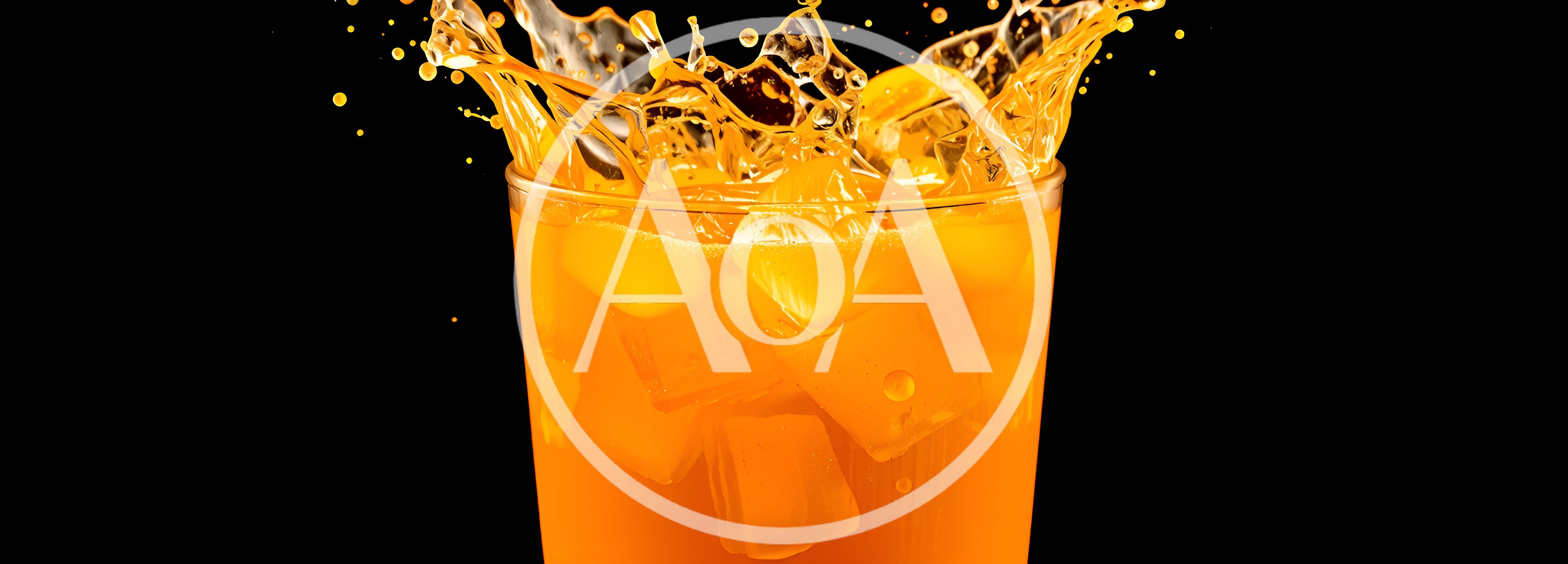 Orange Juice Splash With Ice Cubes In Glass