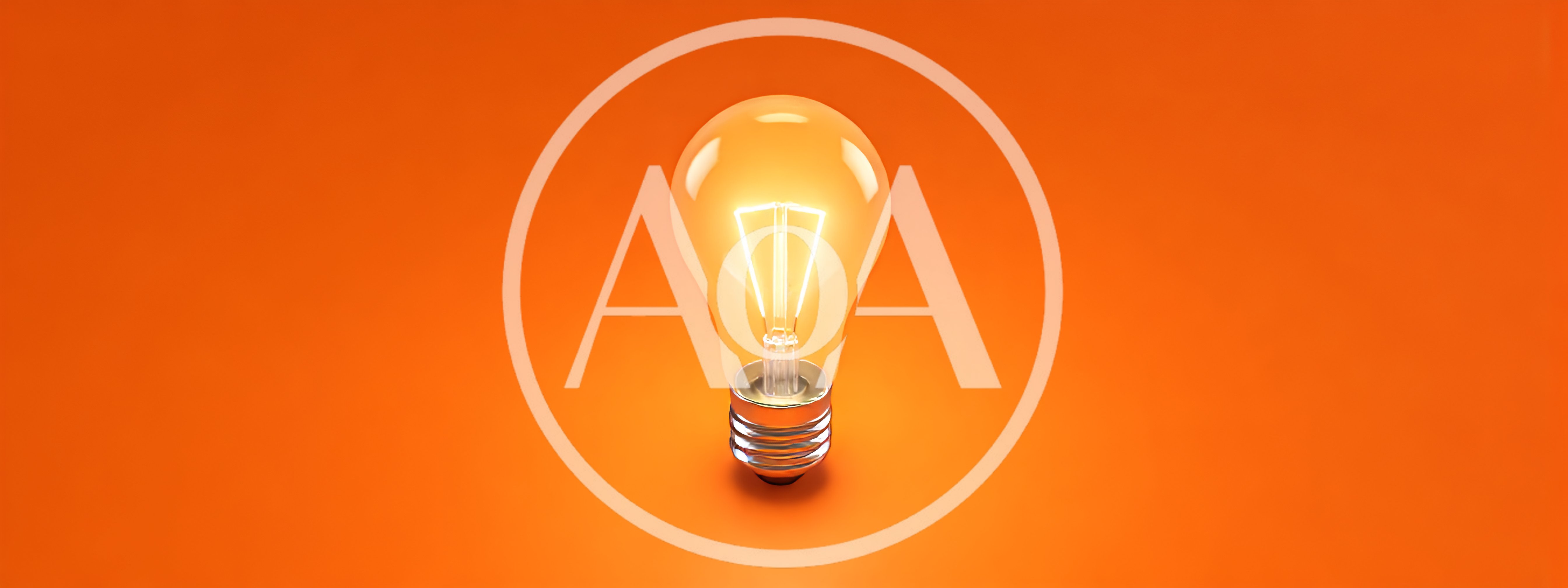 Glowing Light Bulb On Orange Background