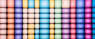Abstract Grid Of Glowing Colorful Rounded Rectangular Panels