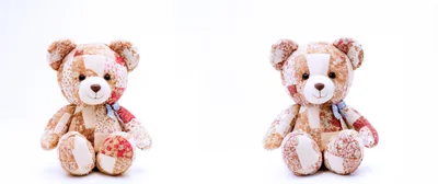 Two Patchwork Teddy Bears Sitting Side By Side
