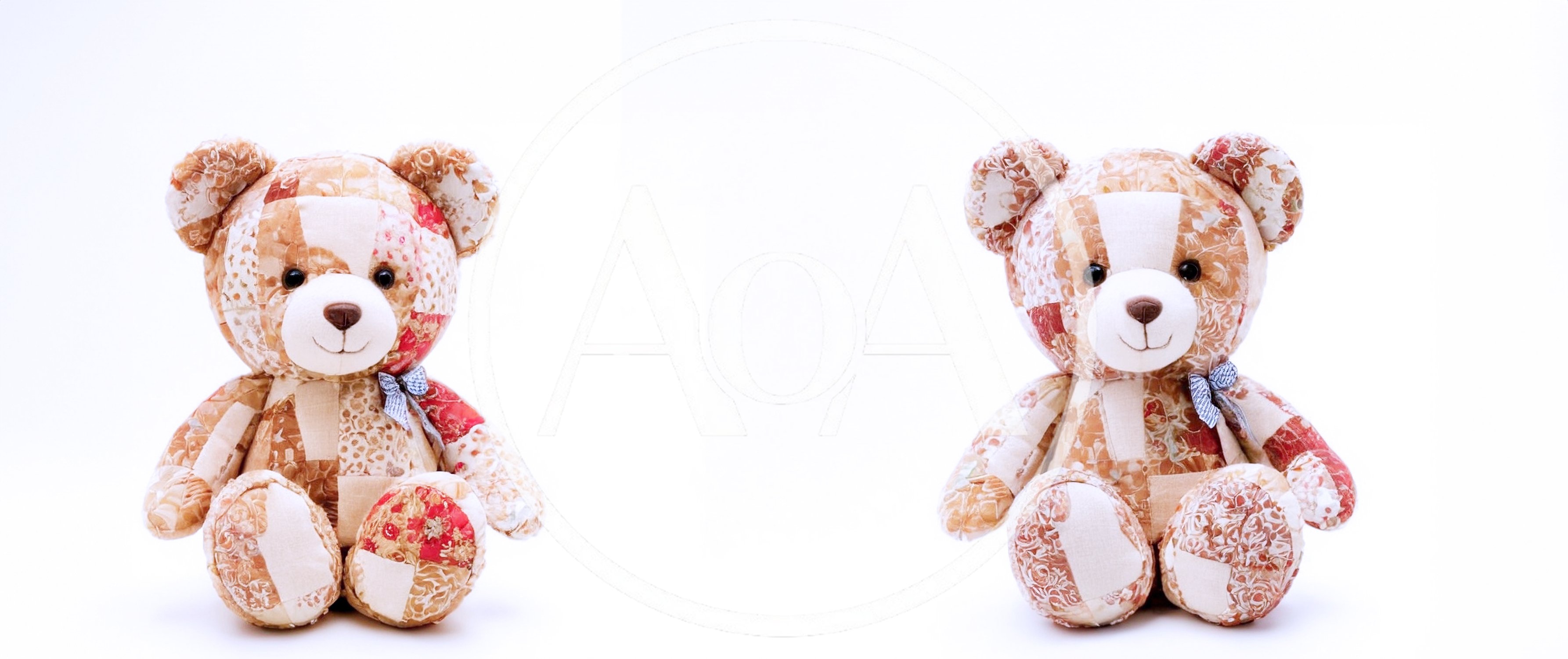 Two Patchwork Teddy Bears Sitting Side By Side