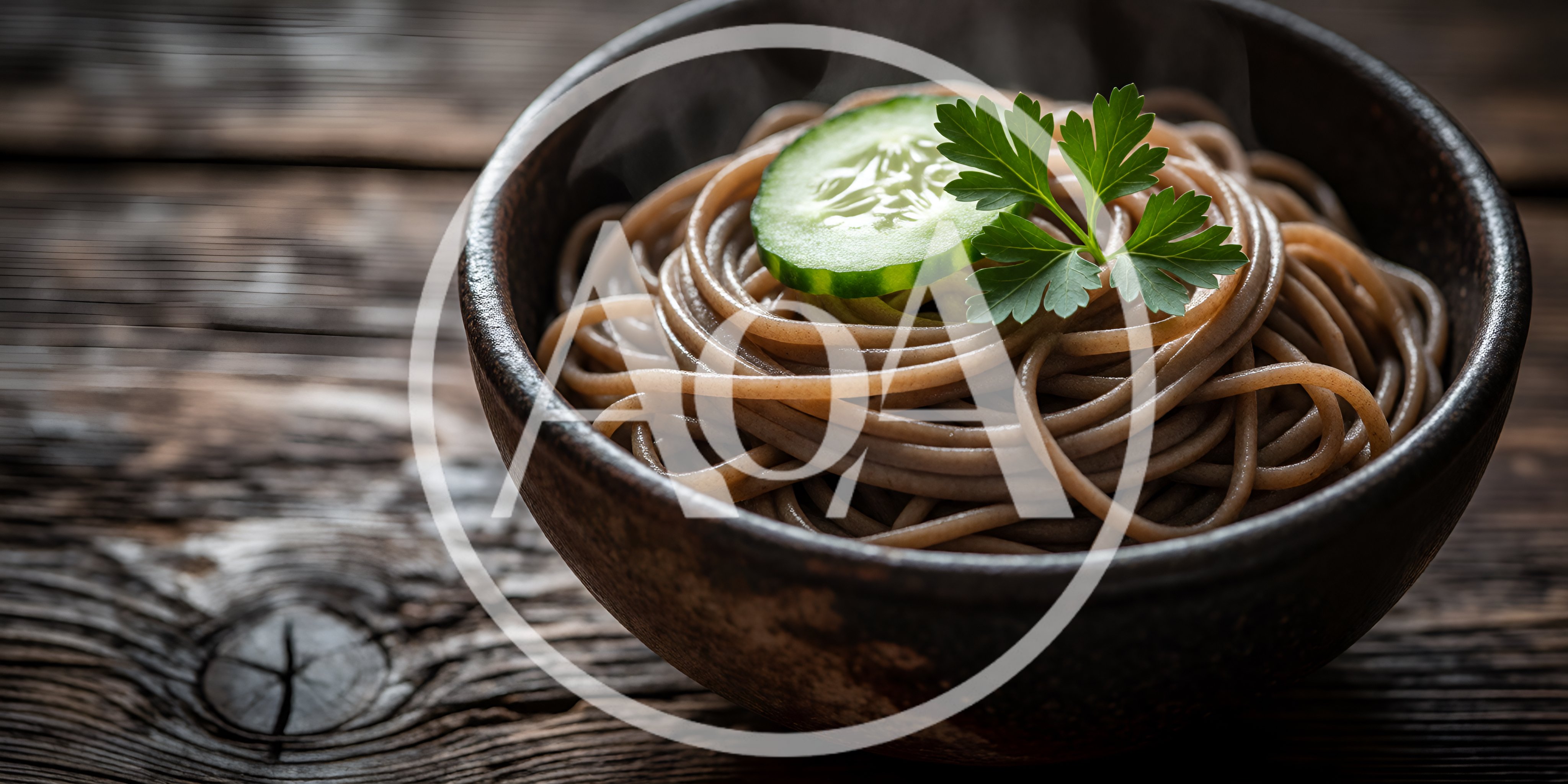 Steaming Bowl Of Soba Noodles With Cucumber And Parsley