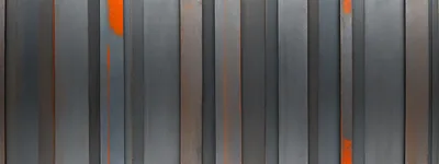 Industrial Metal Wall With Orange Rust Accents