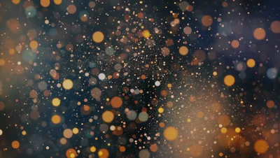 Abstract Golden Bokeh Particles Floating On Dark Background