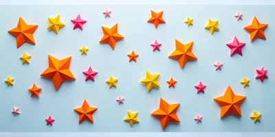 Paper Origami Stars On Light Blue Background