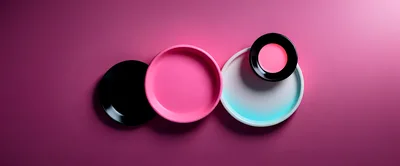 Abstract Composition Of Colorful Circular Plates On Pink Background
