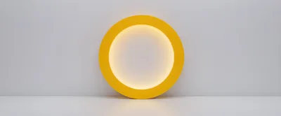 Yellow Circular Light Frame On White Background