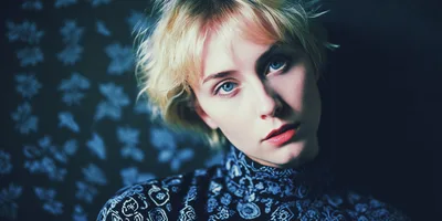 Portrait Of A Young Woman With Blonde Hair