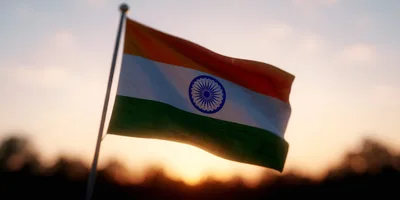 Indian National Flag Waving Against Sunset Sky