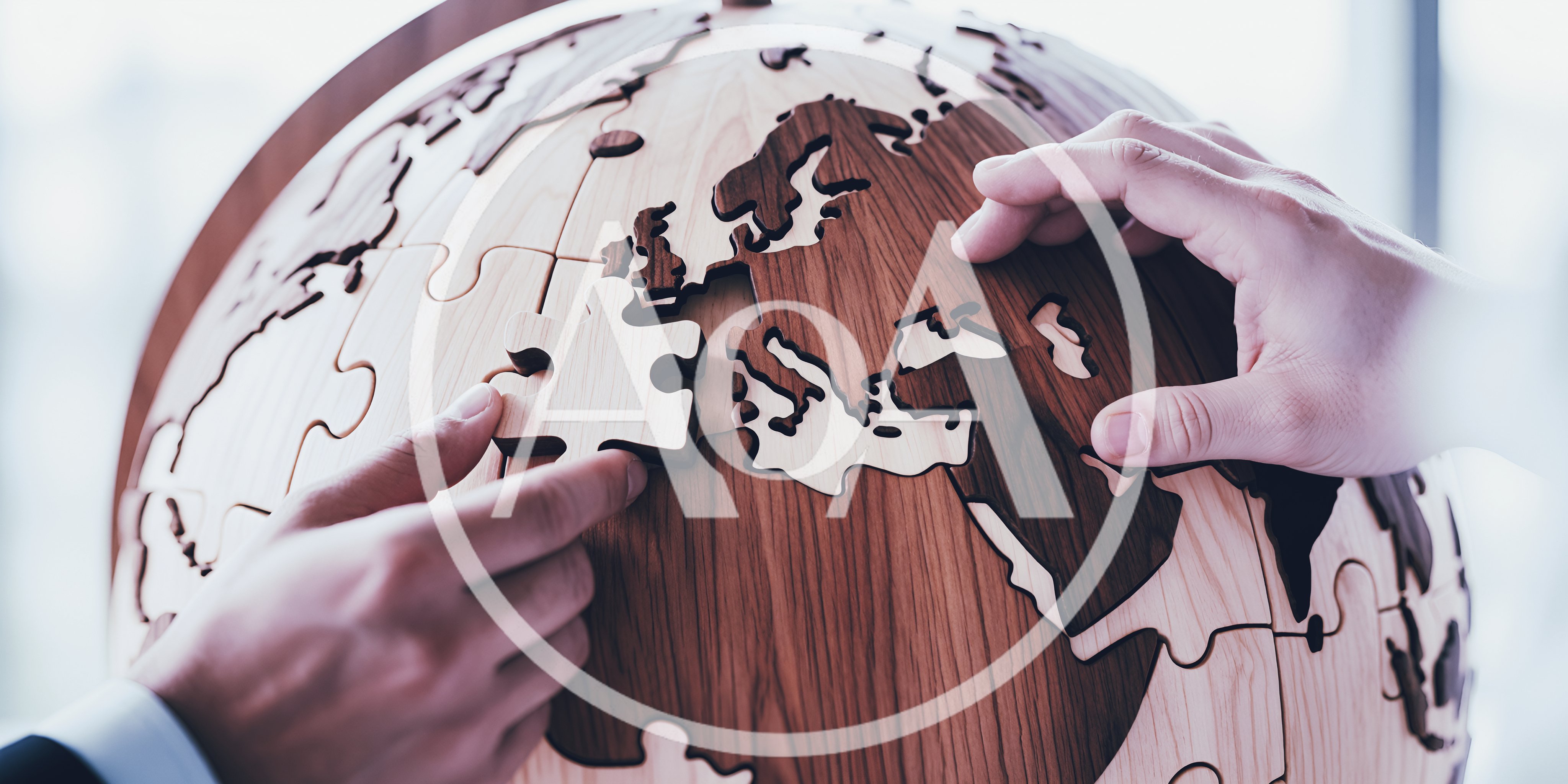 Business People Assembling Wooden World Map Puzzle