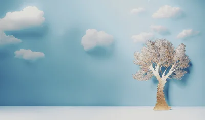 Minimalist Paper Craft Tree Against Blue Sky Background