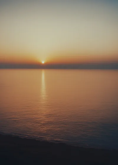 Golden Sunset Over The Calm Ocean Horizon