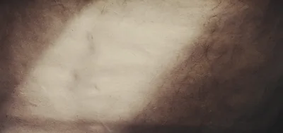 Textured Brown Paper Background With Light Gradient