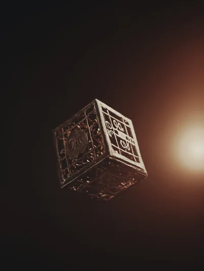 Floating Ornate Metallic Cube With Intricate Engravings