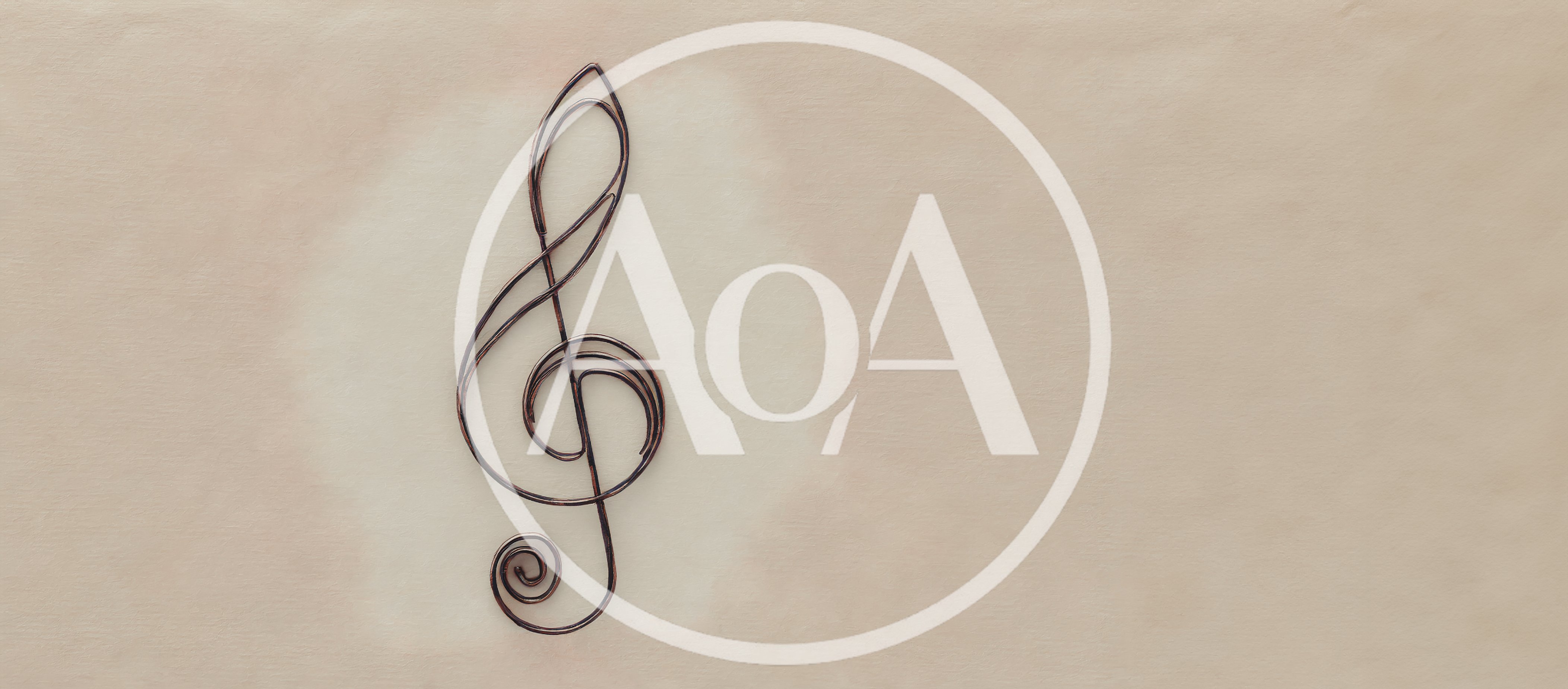 Metal Treble Clef Symbol on Textured Beige Background
