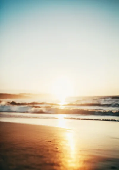 Golden Hour Sunset Over A Calm Sandy Beach