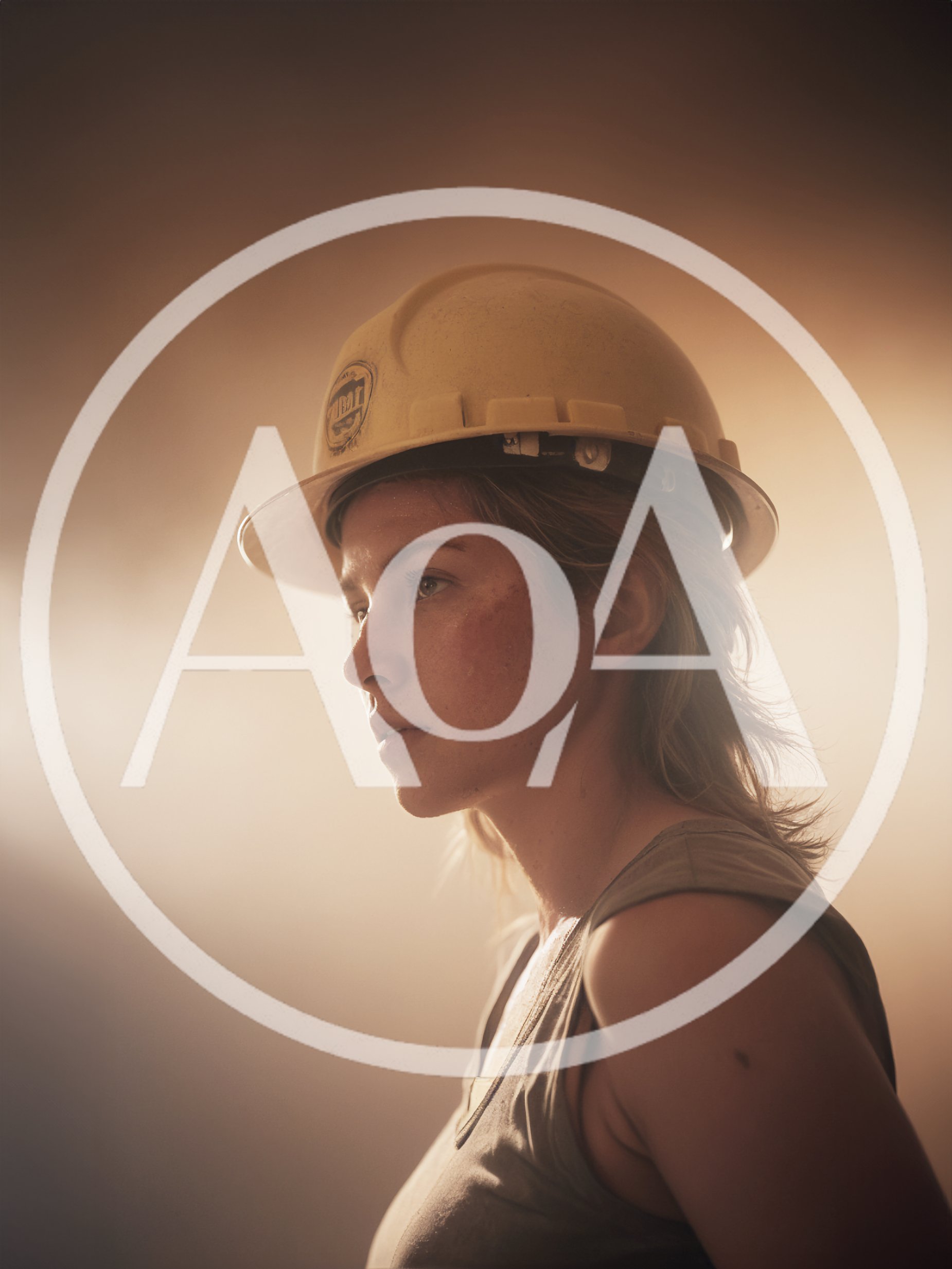 Portrait Of A Female Construction Worker In Dusty Light