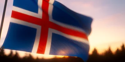 Icelandic Flag Waving Against A Sunset Sky