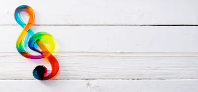 Colorful Treble Clef Symbol on White Wooden Background