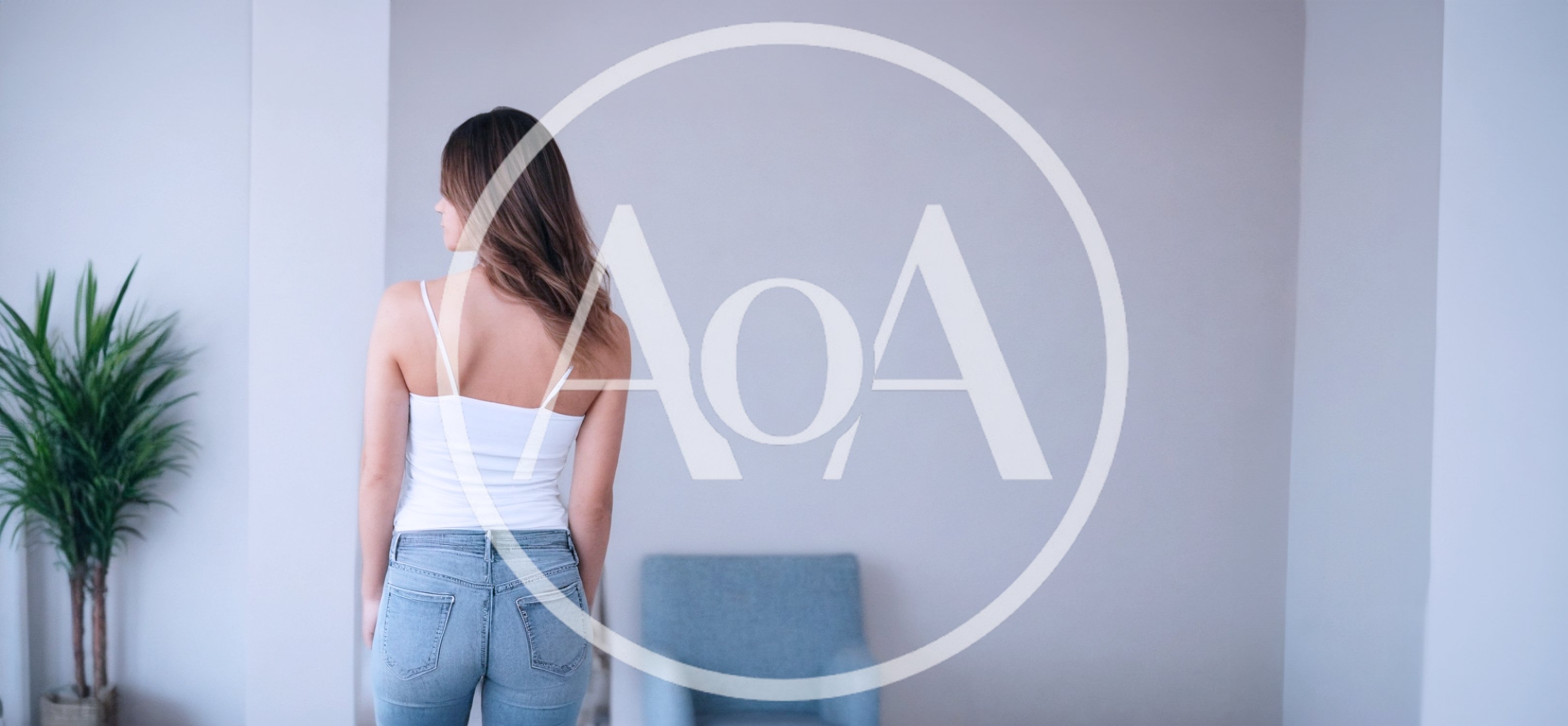 Young Woman Standing In A Minimalist Living Room