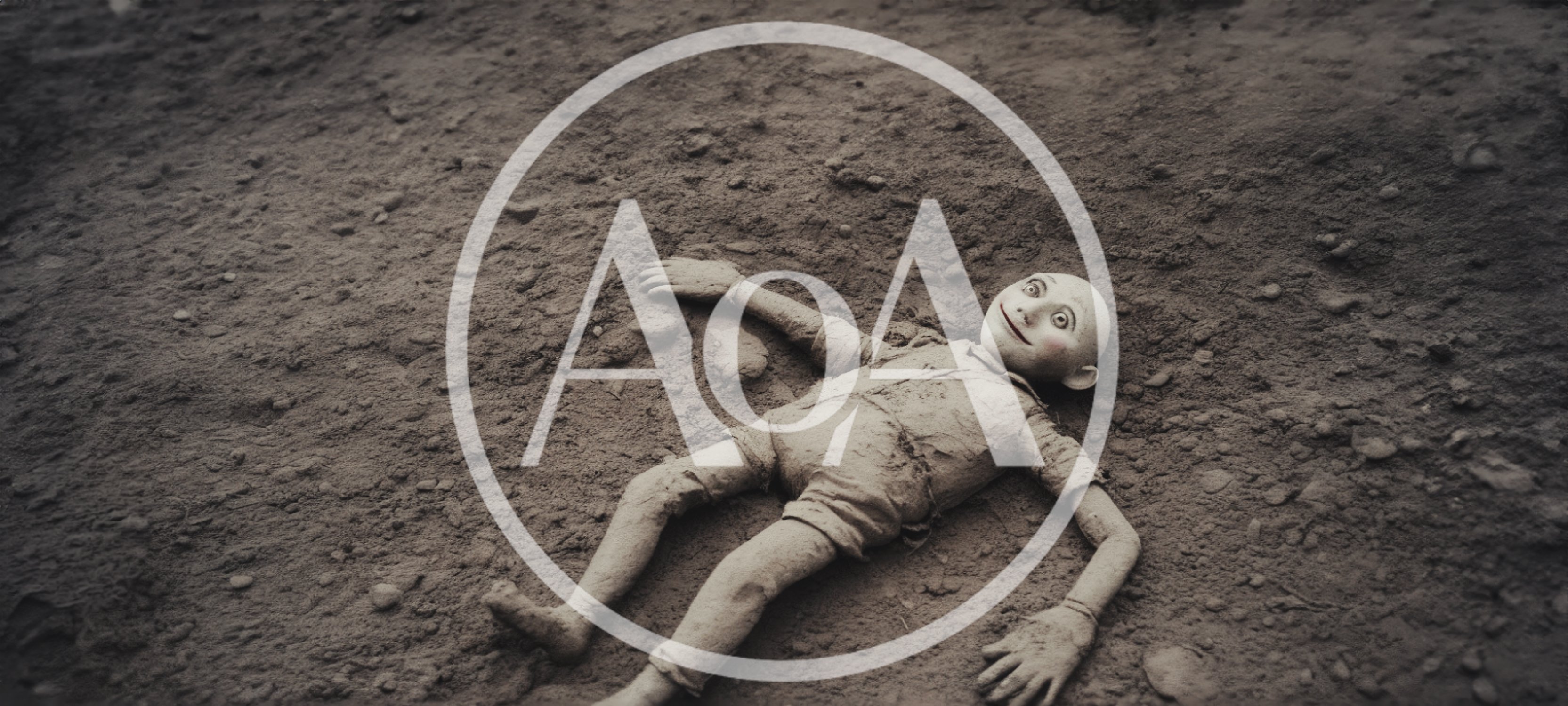 Creepy Doll Lying On Dusty Ground