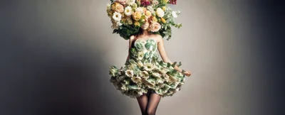 Fashion Model Wearing Elaborate Floral Dress And Headpiece