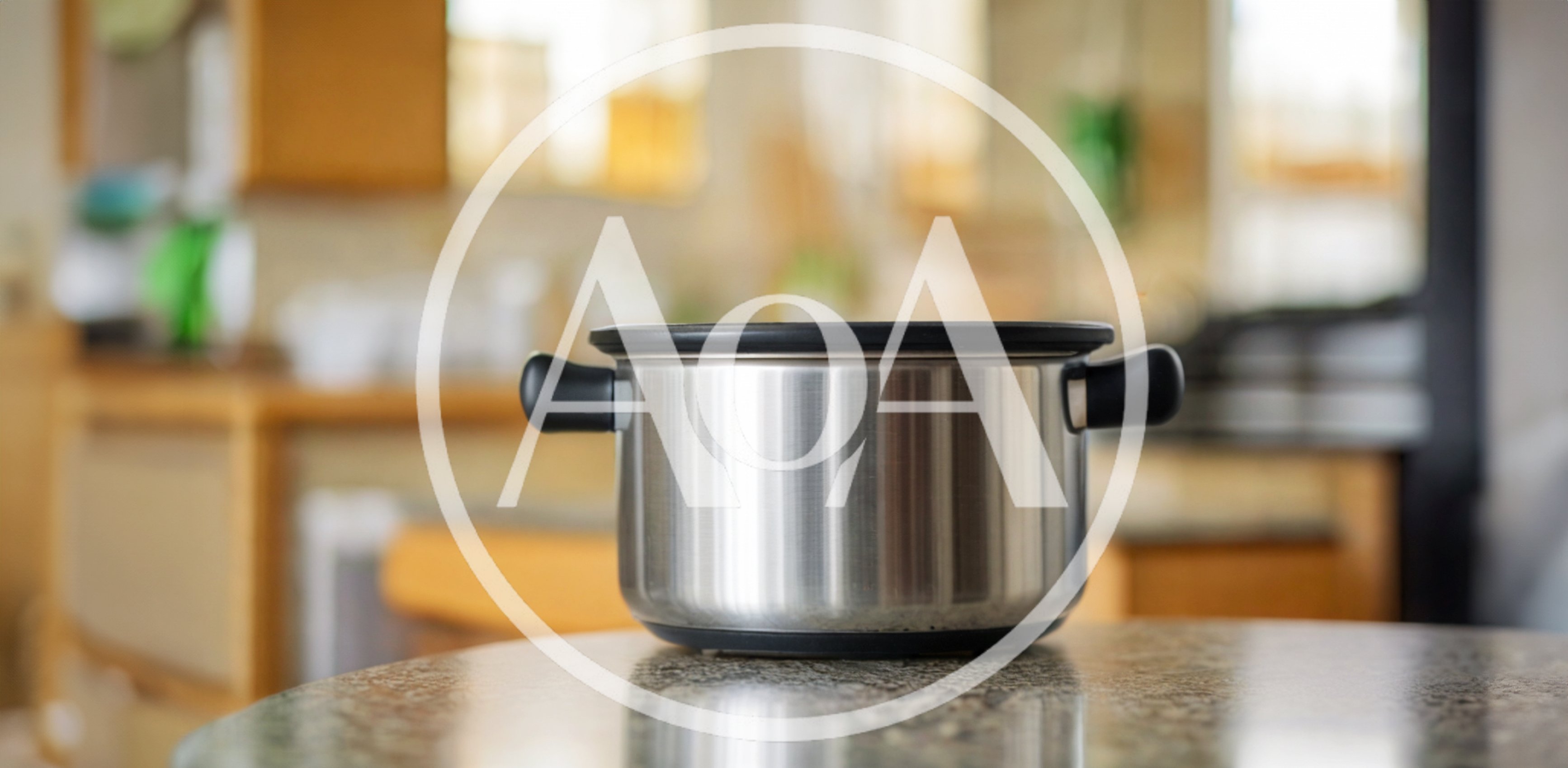 Stainless Steel Cooking Pot On Granite Countertop