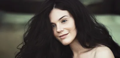Portrait Of A Young Woman With Long Dark Hair