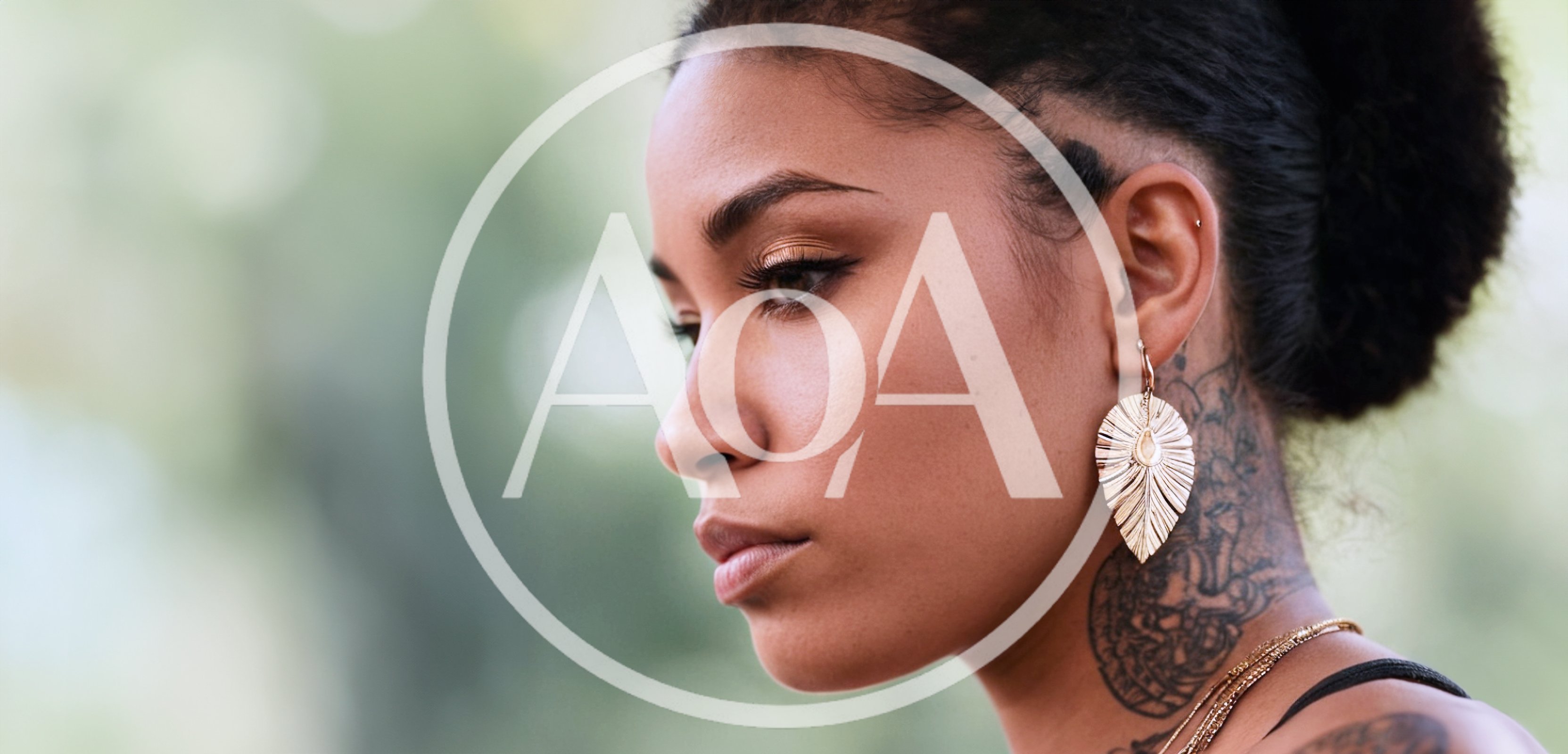 Profile Portrait Of A Young Woman With Tattoos