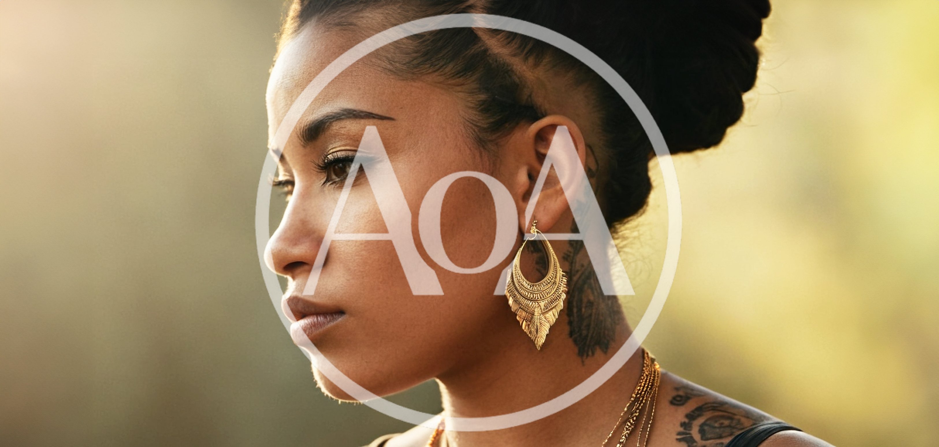 Profile Portrait Of A Woman With Gold Earrings