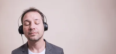 Man Listening To Music With Headphones