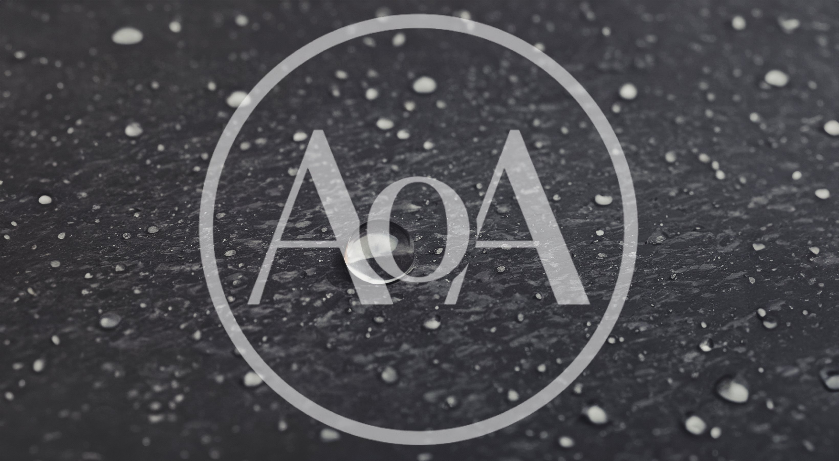 Water Droplets On A Dark Textured Surface