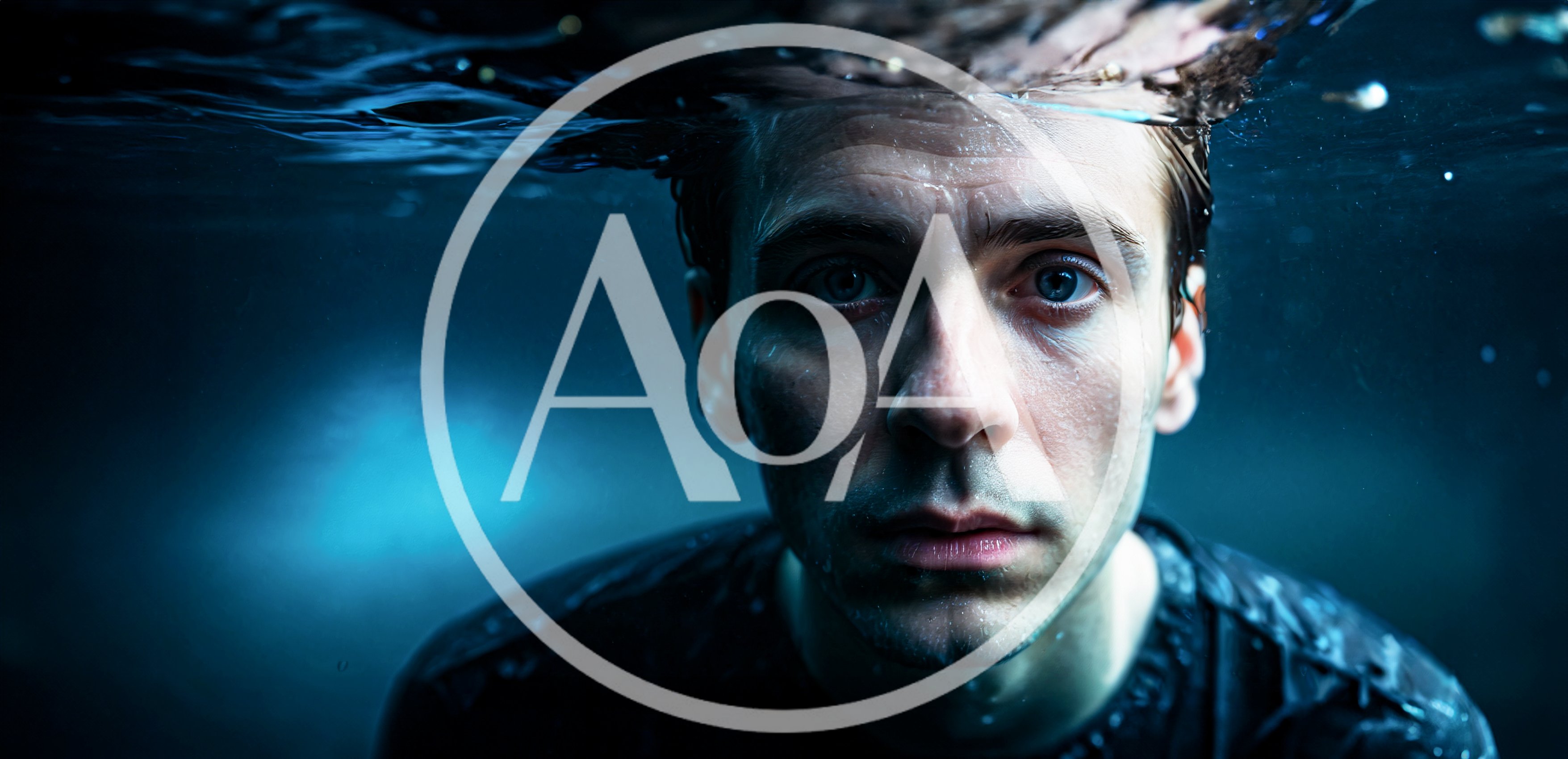 Man Submerged Underwater Looking Directly At Camera