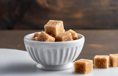Brown Sugar Cubes in a White Bowl