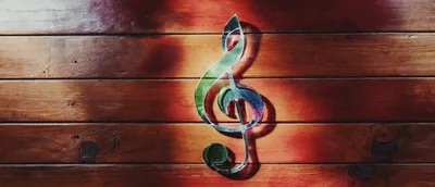 Iridescent Treble Clef Symbol on Wooden Planks