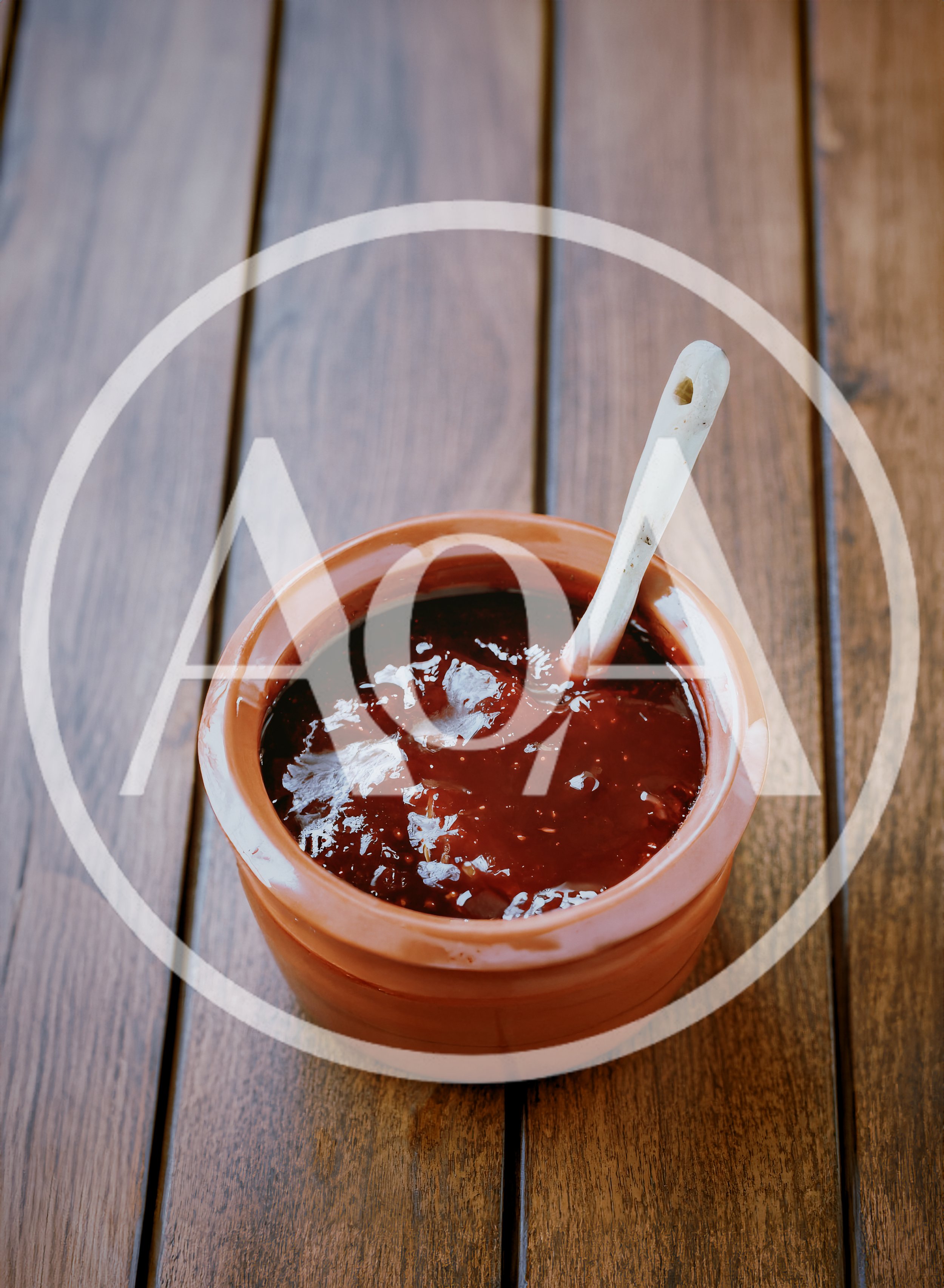 Ceramic Pot Filled With Dark Red Fruit Jam