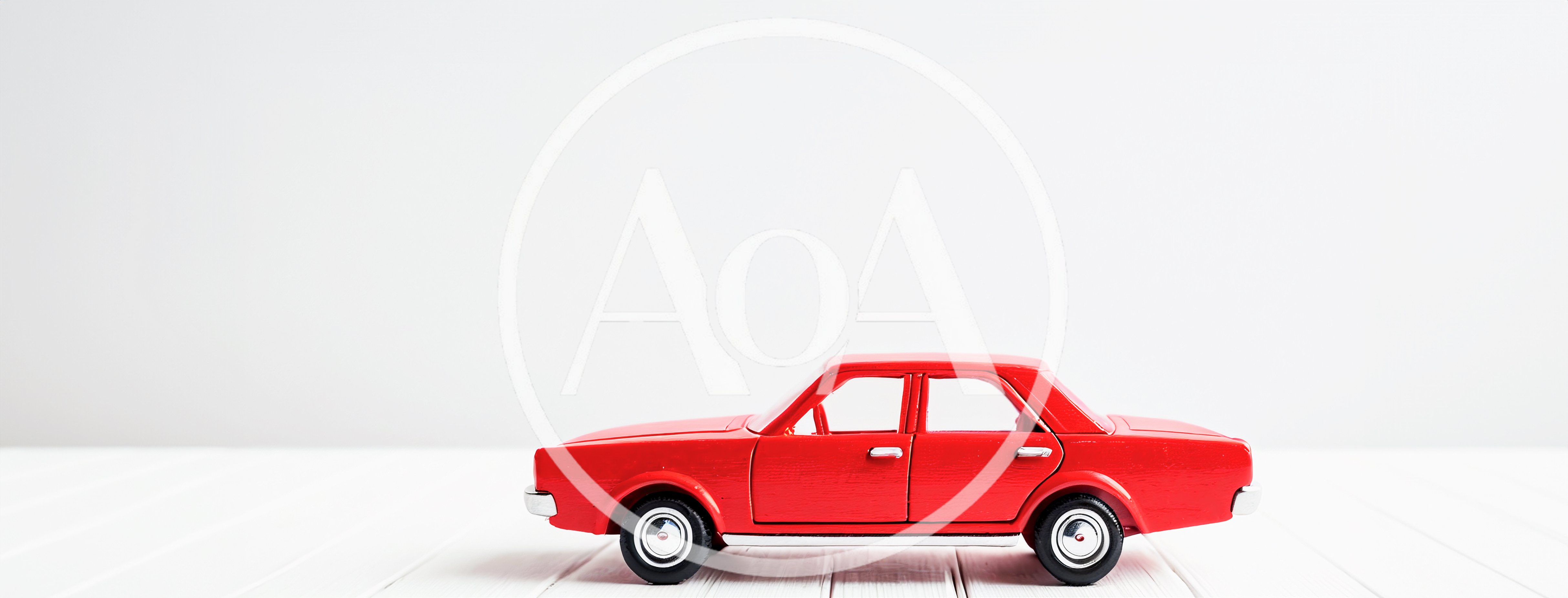 Red Toy Car On White Wooden Surface