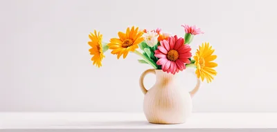 Colorful Gerbera Daisies In A Ceramic Vase
