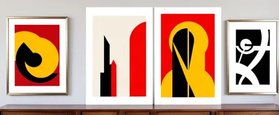 Four Abstract Geometric Art Prints Displayed On A Credenza